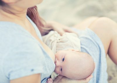 21023834 - mother breastfeeding a baby outdoor