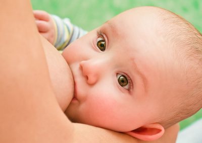 23083034 - mother breastfeeding her baby with breast milk